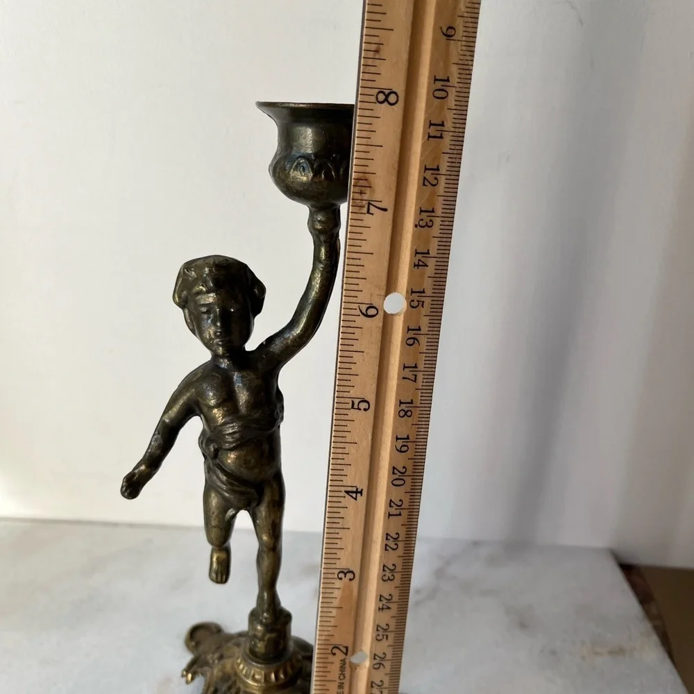 Antique cherub figurine candle holder